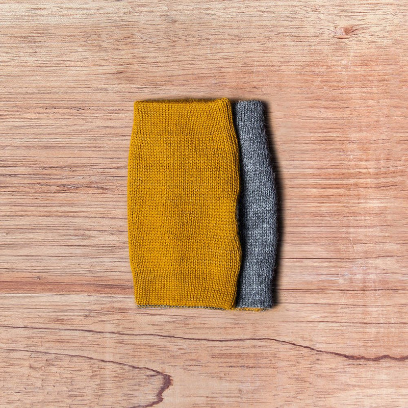 Inside out gloves made of alpaca wool in the color mustard and grey