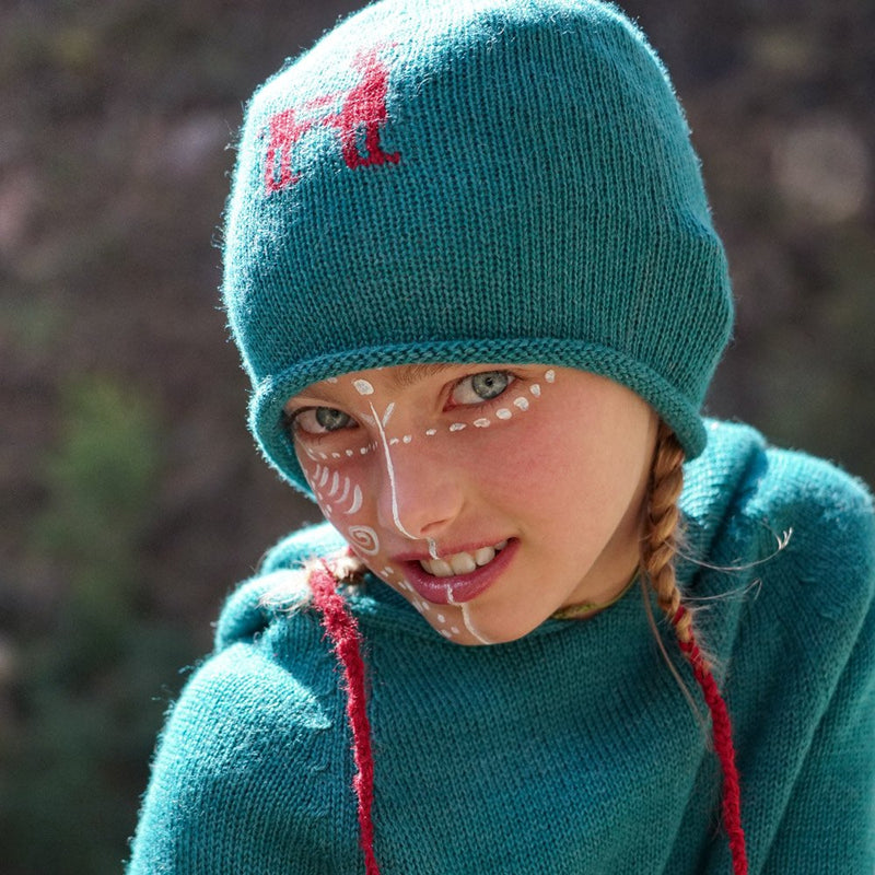 Girl with blue colored baby alpaca wool beanie