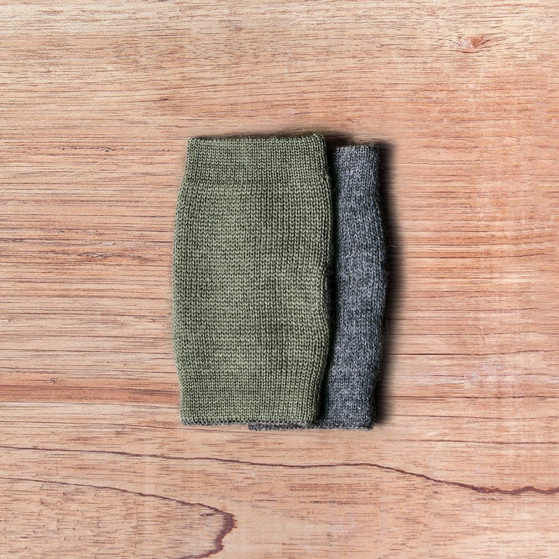 Inside out gloves made of alpaca wool in the color green and grey