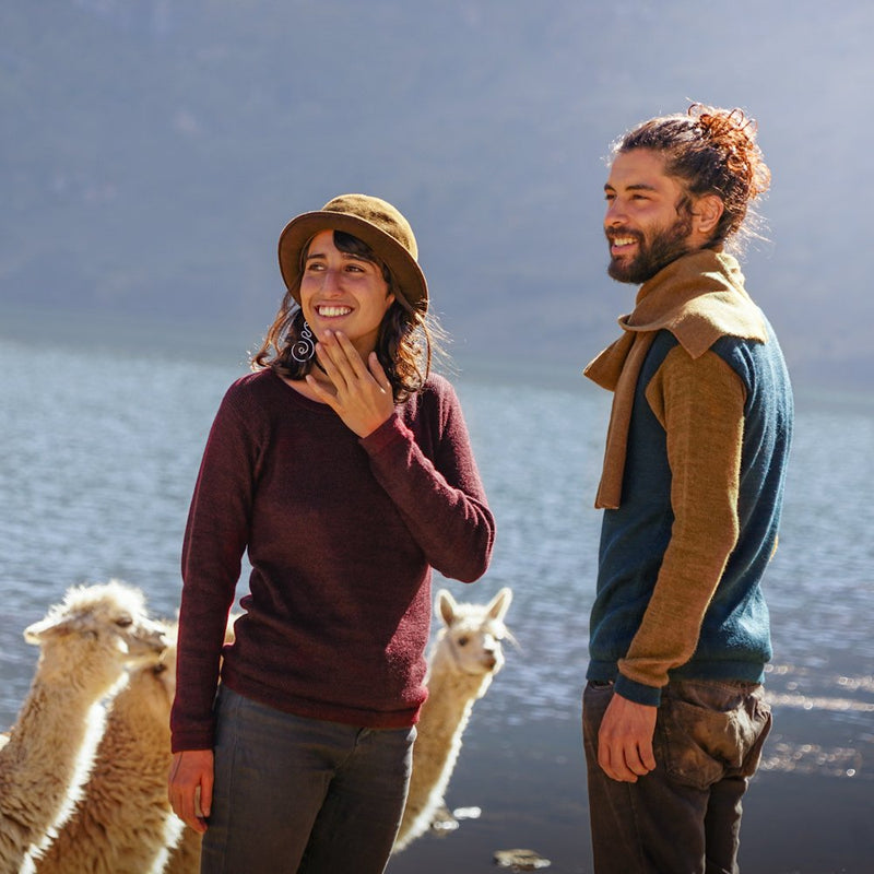 Couple with baby alpaca wool clothes in different colors